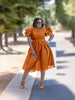 Belted vintage puff sleeve midi dress in rust-orange, short puff sleeves and waist belt