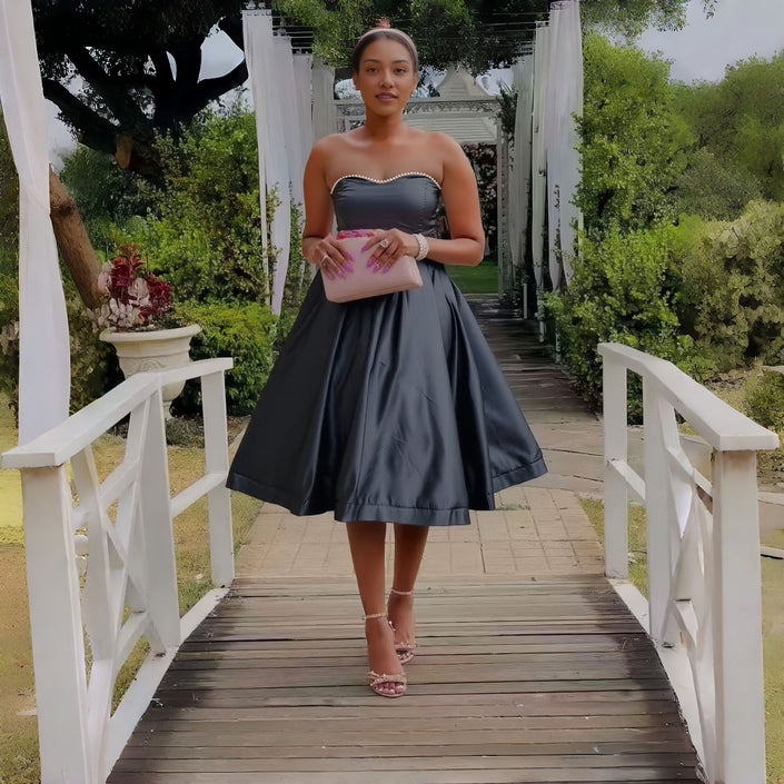 Black strapless midi dress with sweetheart neckline and flared waist detail