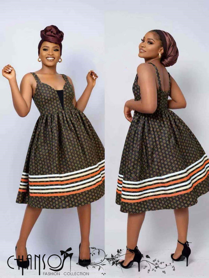African print flare dress by Heritage Wear, dark sleeveless with striped hem