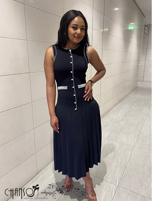 Black sleeveless knitted midi dress with long button placket and pleated skirt