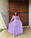 Light-purple maxi dress with floral cutout waist, sleeveless bodice, pleated full skirt