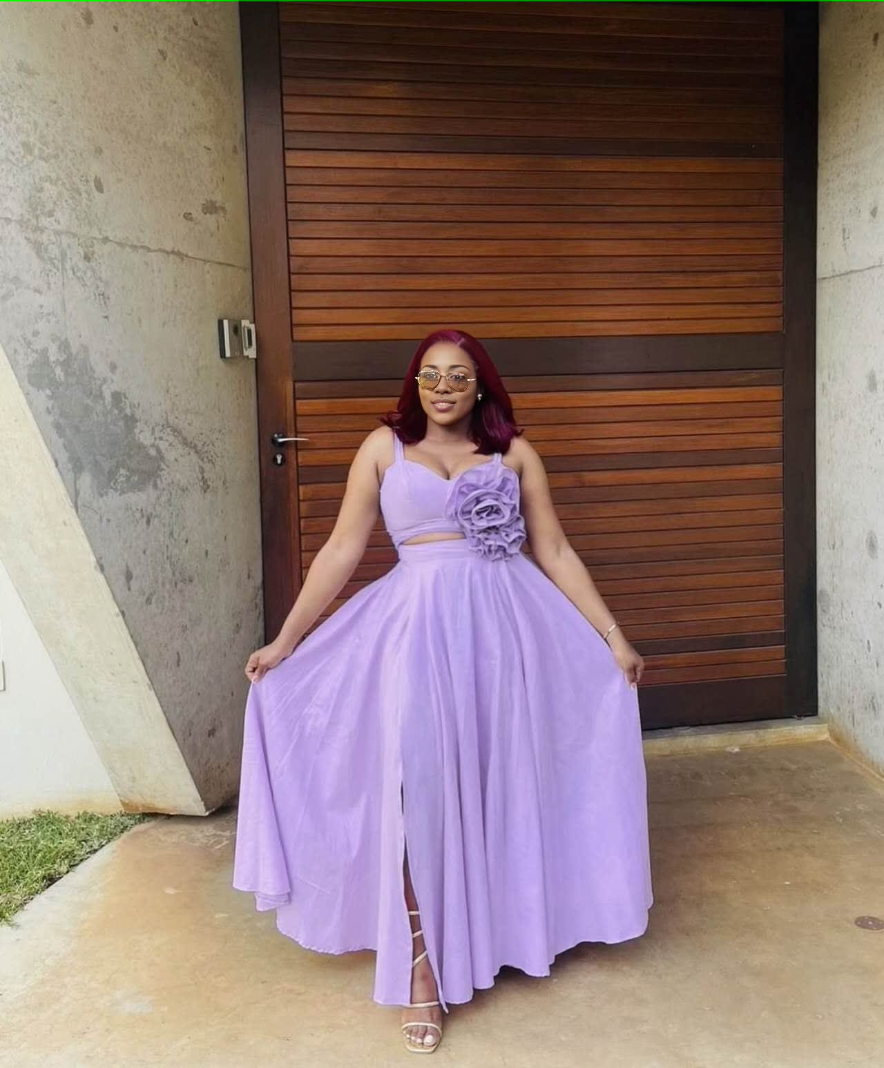Light-purple maxi dress with floral cutout waist, sleeveless bodice, pleated full skirt