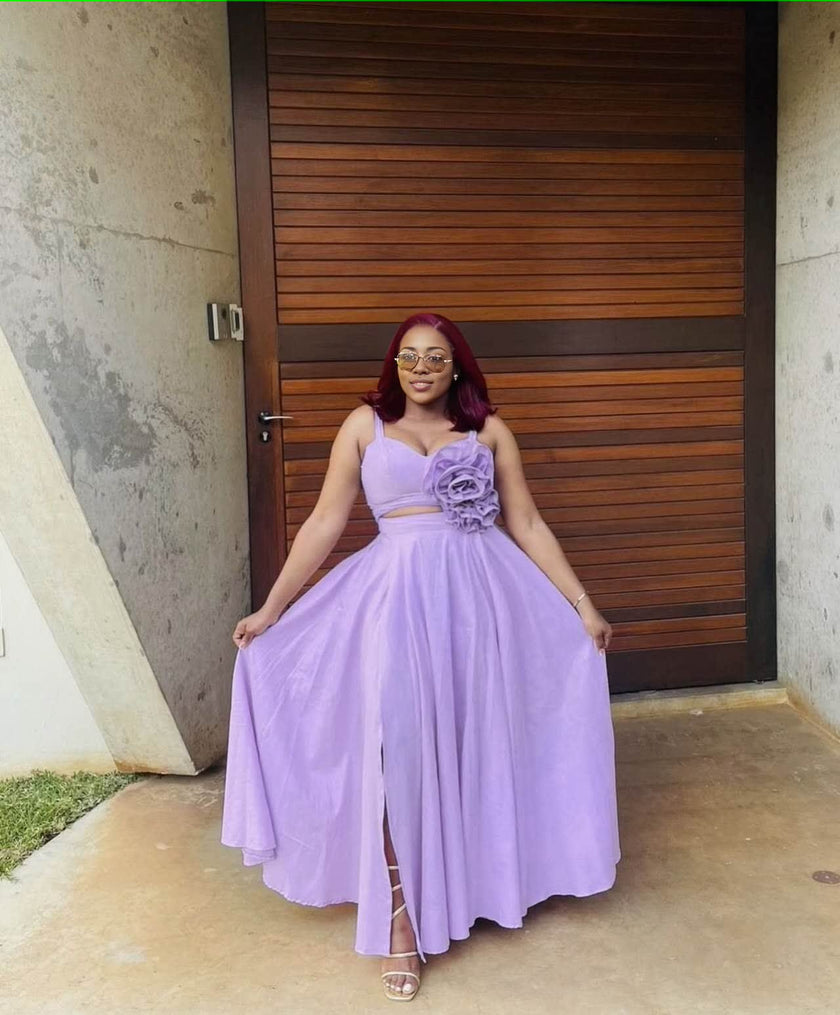 Light-purple maxi dress with floral cutout waist, sleeveless bodice, pleated full skirt
