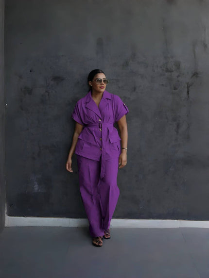 Purple belted lapel pantsuit with front flap pockets and tapered trousers