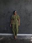 Dark-olive belted lapel pantsuit with utility pockets and matching trousers