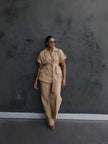Nude belted lapel pantsuit with short sleeves and matching straight-leg trousers