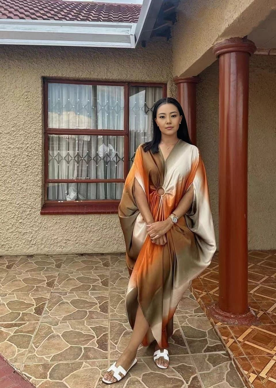 Plus size geometric batwing midi dress with orange and light panels, long batwing sleeves