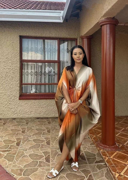 Plus size geometric batwing midi dress with orange and light panels, long batwing sleeves