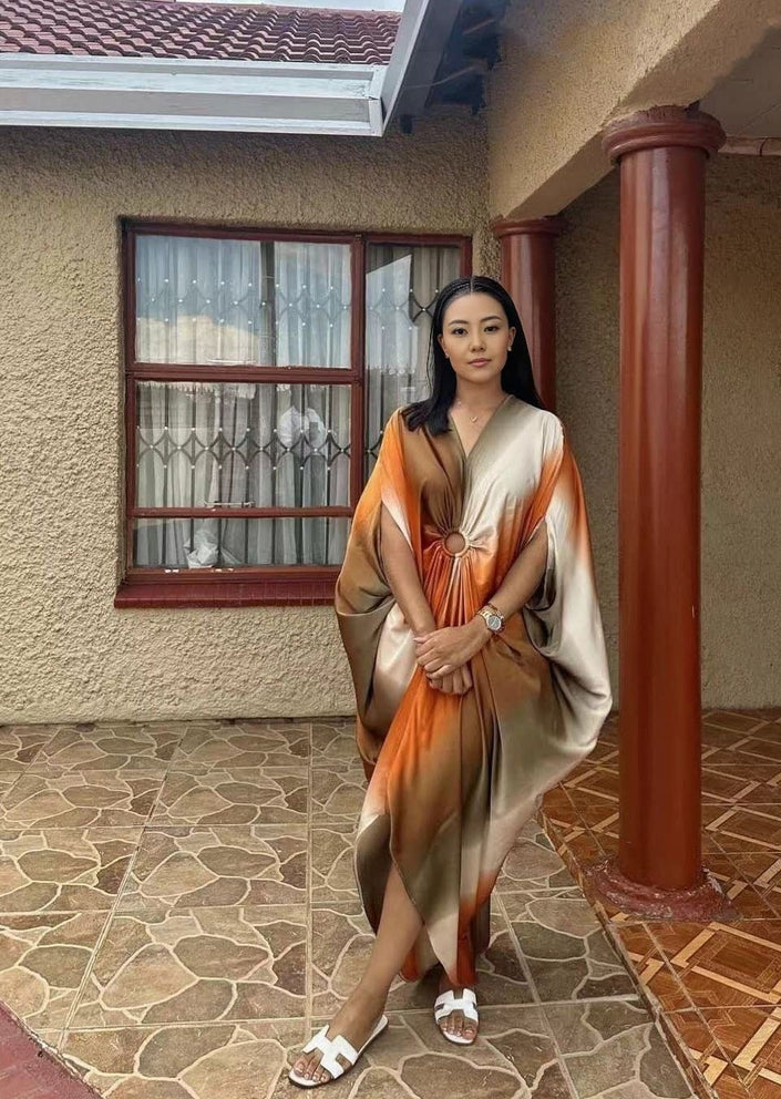 Plus size geometric batwing midi dress with orange and light panels, long batwing sleeves