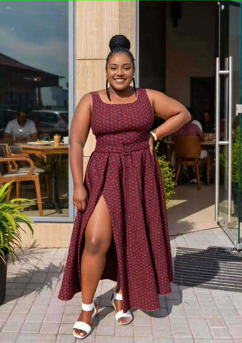 Sleeveless maroon maxi dress with tribal print, gathered waist and side slit