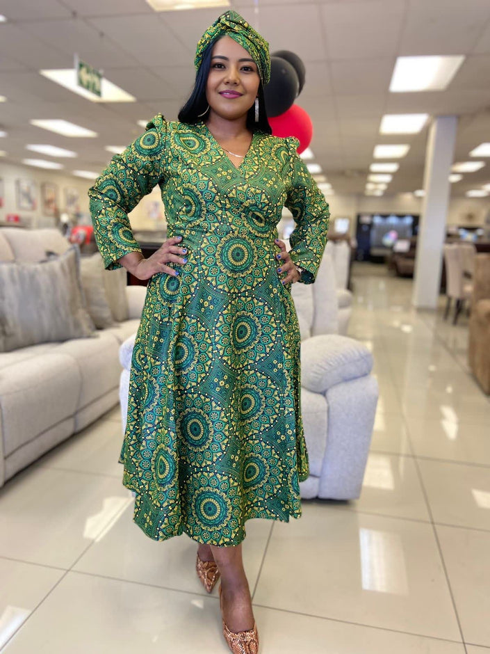 Green geometric print A-line midi dress with long sleeves and V-neck