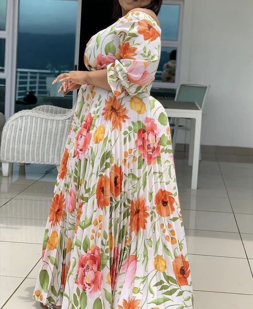 Floral maxi dress with puff sleeves and pleated full skirt