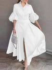 White belted maxi dress with puff sleeves and a V-neck, full skirt