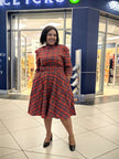 Plaid flared knee-length dress in red with long sleeves