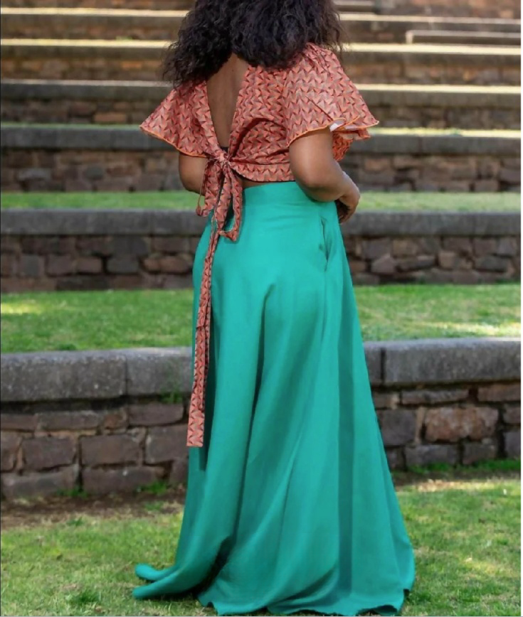 Geometric twin set: pink patterned crop top with back tie and turquoise flared maxi skirt