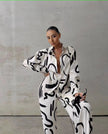 Black-and-white abstract print twin set: button-up shirt with wide-leg pants