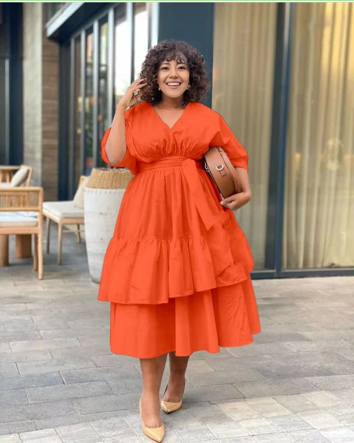 Orange-red tiered midi dress with puff sleeves and adjustable waist detail