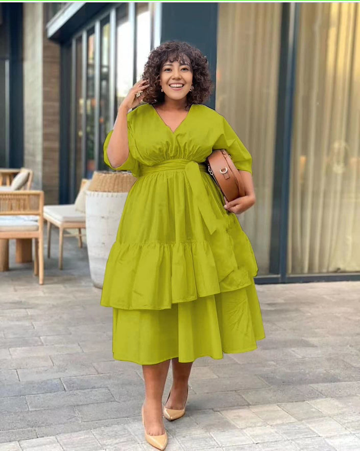 Green tiered midi dress with puff sleeves and cinched adjustable waist