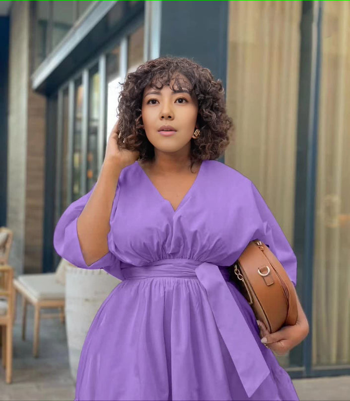 Purple tiered midi dress with V-neck puff sleeves and gathered waist