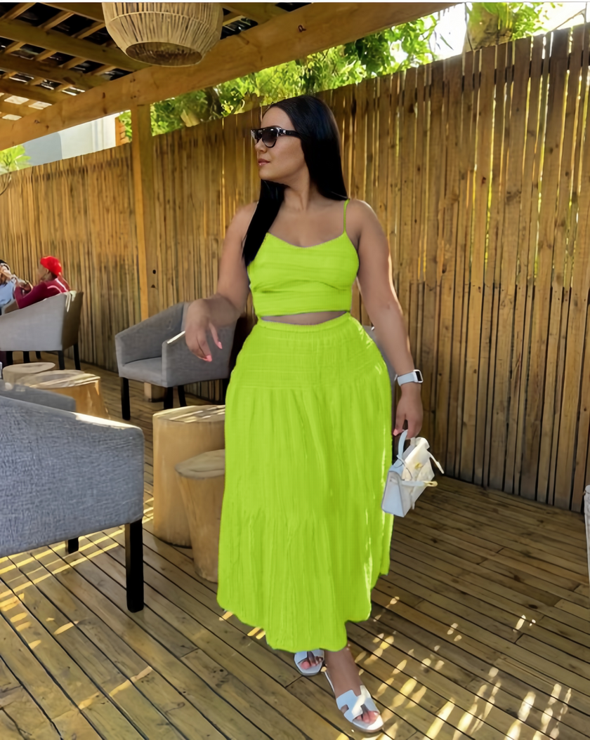 Green pleated maxi skirt and spaghetti-strap crop top set with tiered ruffles
