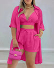 Deep pink three-piece twin set with button-front crop top, drawstring shorts, open shirt