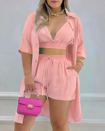 Pink three-piece twin set with button-front crop top, drawstring shorts, open shirt