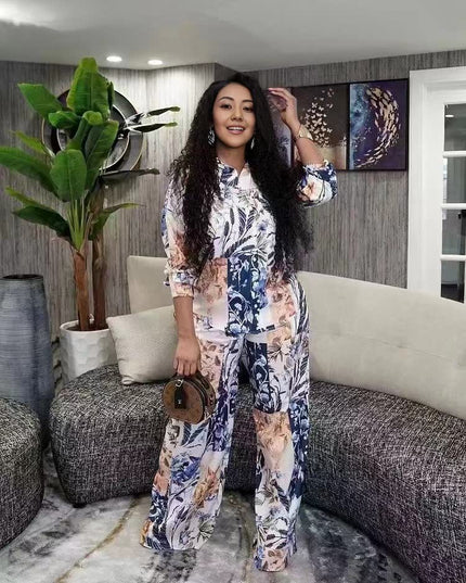 Floral printed twin set: long-sleeve top and matching wide-leg trousers, blue and cream.