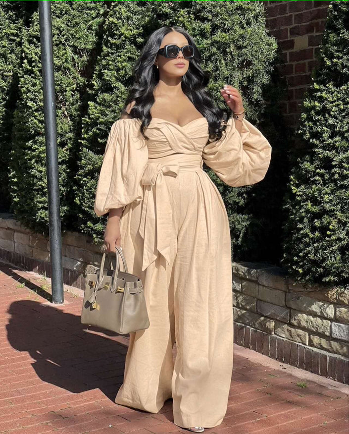 Tan off-shoulder puff sleeve jumpsuit with wide legs and gathered waist