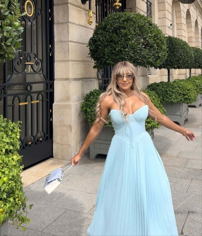 Light blue strapless pleated maxi dress with sweetheart neckline and fitted bodice