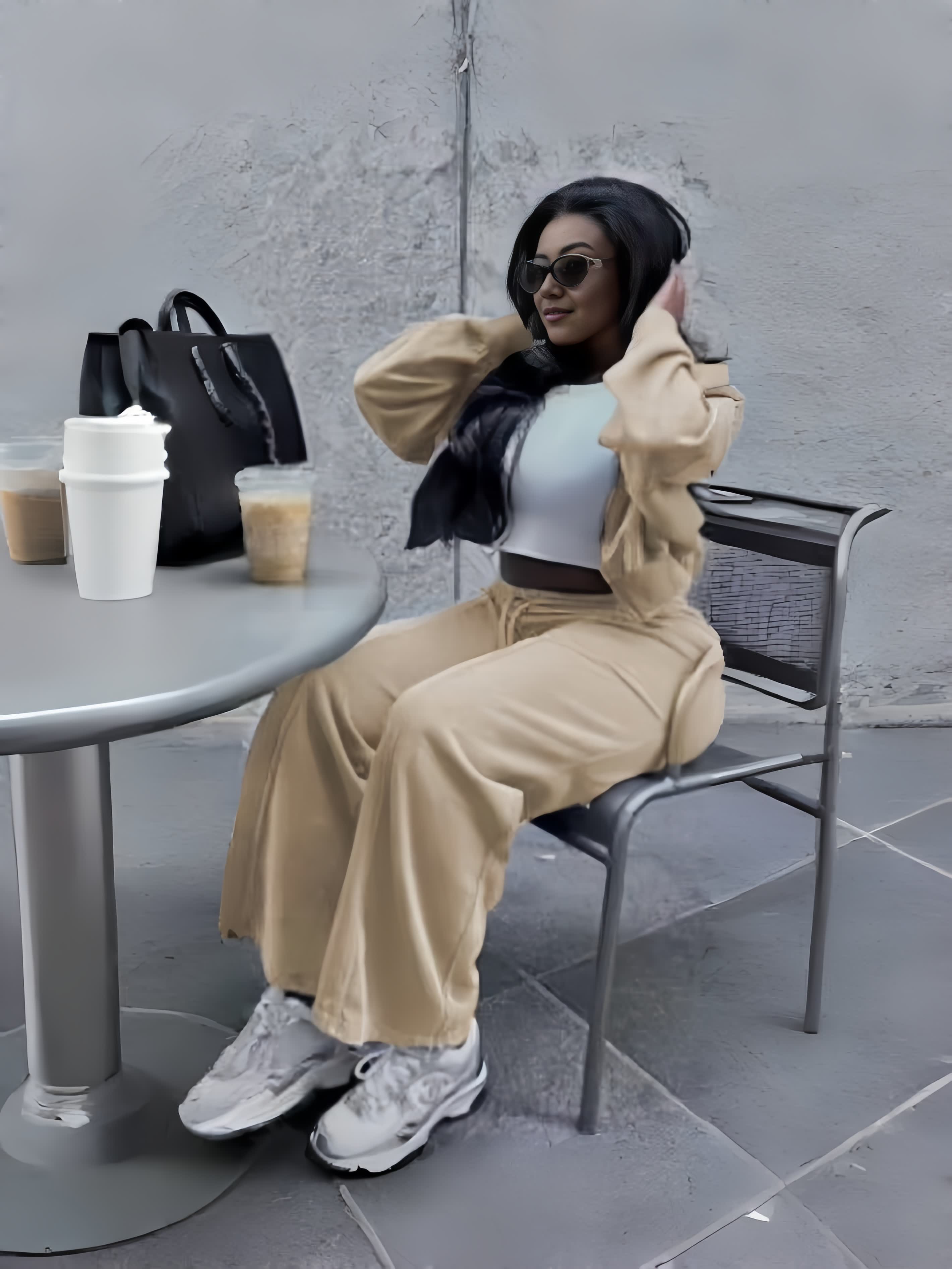 Tan zip jacket and tapered pants loungewear set, seated