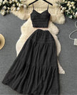 Black pleated maxi skirt and spaghetti-strap crop top set with tiered ruffles