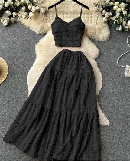 Black pleated maxi skirt and spaghetti-strap crop top set with tiered ruffles