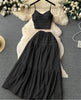 Black pleated maxi skirt and spaghetti-strap crop top set with tiered ruffles