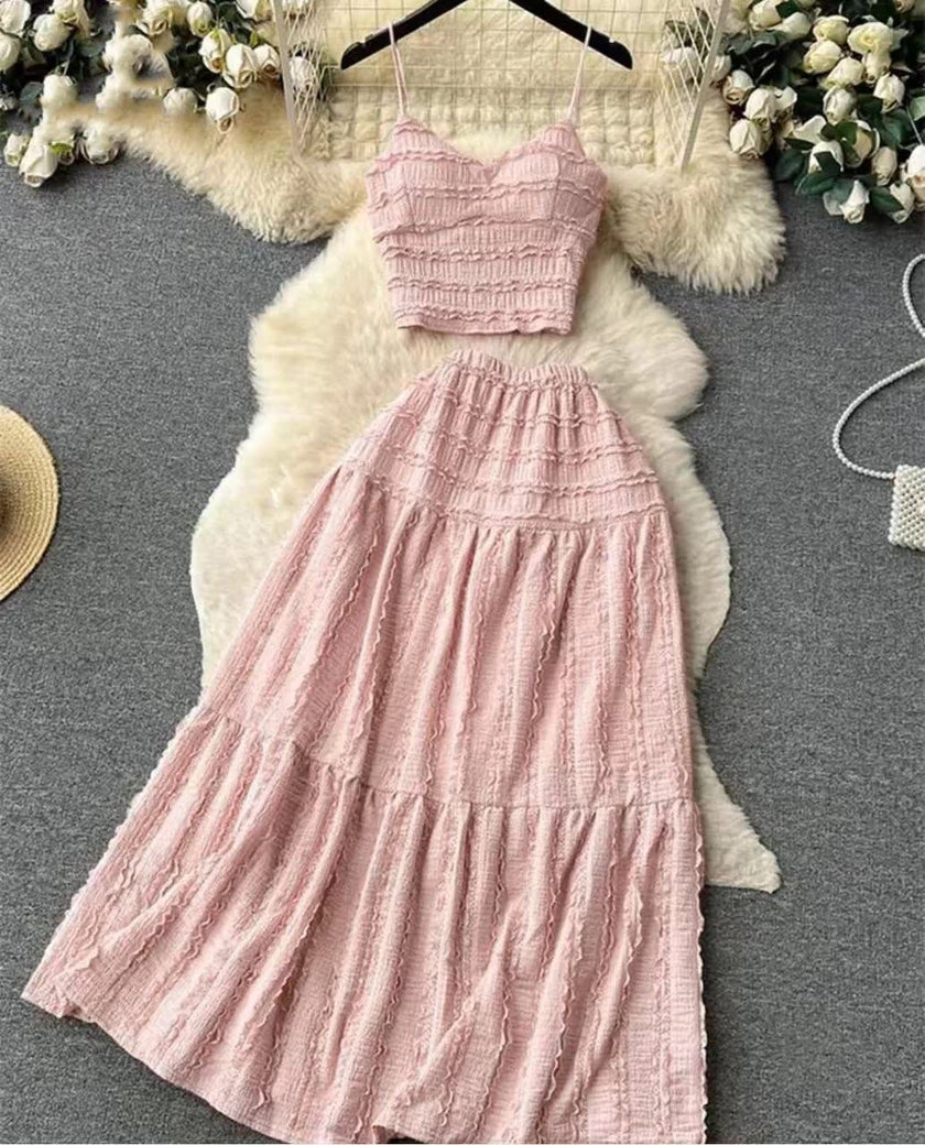 Pink pleated maxi skirt and spaghetti-strap crop top set with tiered ruffles