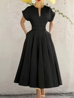 Black A-line midi dress with pleated skirt, short sleeves, keyhole neckline, waist buttons