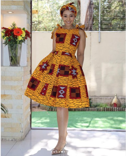 Ruffle puff-sleeve midi dress with yellow-orange patterned fabric and round neckline