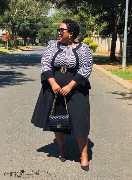 Plus size wavy striped contrast midi dress with navy bodice and black A-line skirt