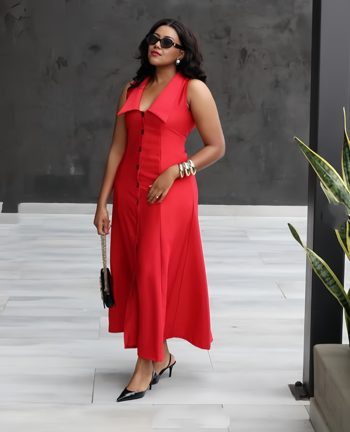 Red sleeveless lapel midi dress with button front and V-neck, flowing midi length.