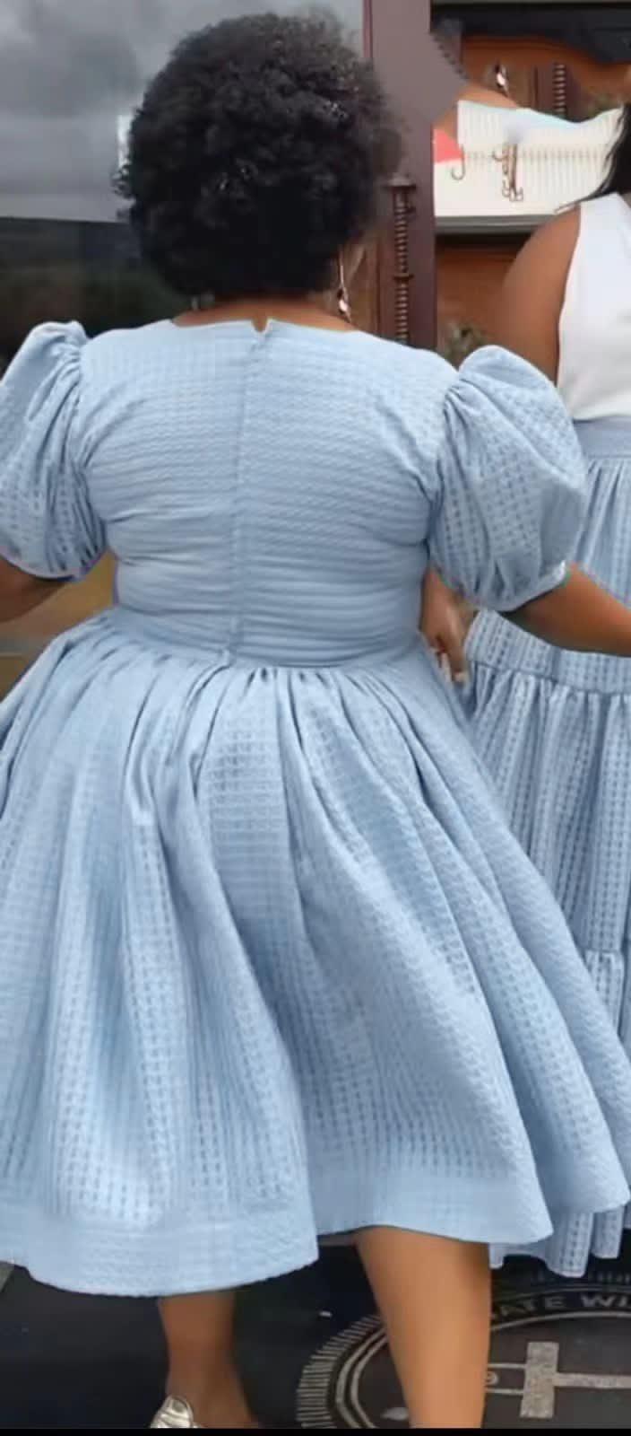 Textured midi dress with puff sleeves and smocked waist in light blue