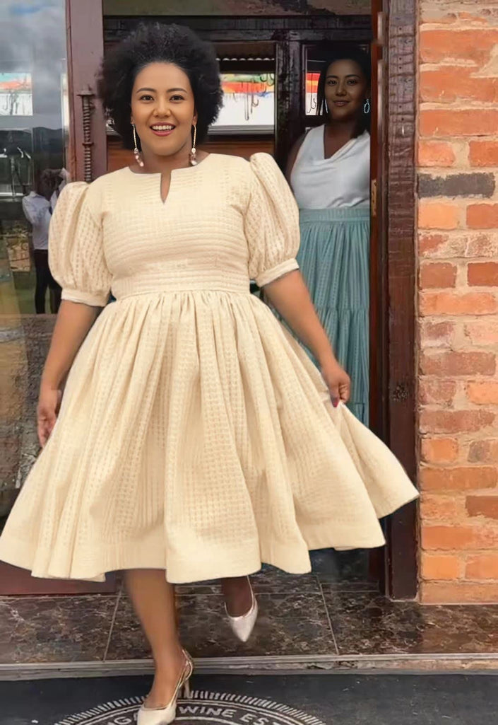 Textured midi dress, puff sleeves, smocked waist, full skirt in wheat