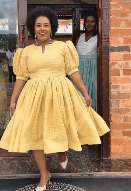 Textured midi dress, puff sleeves, smocked waist, full skirt in yellow