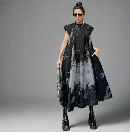 Pleated midi dress with abstract black-and-gray print, sleeveless button front and flared skirt