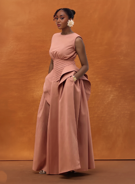 Blush sleeveless corset-waist maxi gown with ruched waist and full skirt