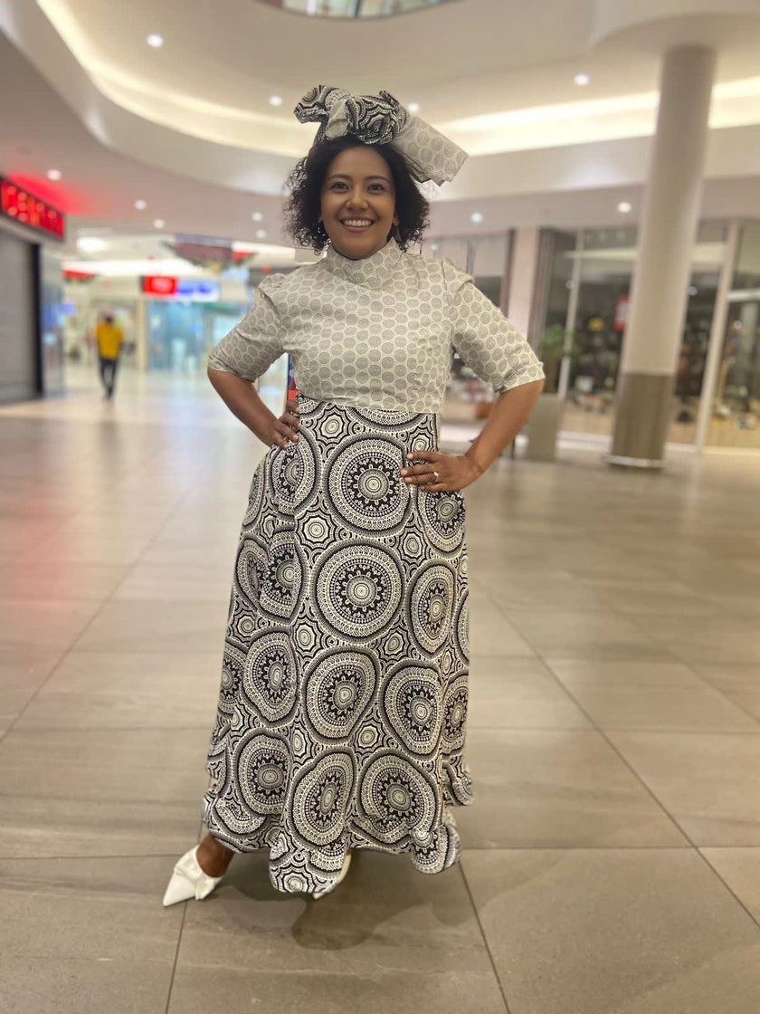 Traditional Flared Skirt Dress with Fitted Bodice and Circular Pattern Design