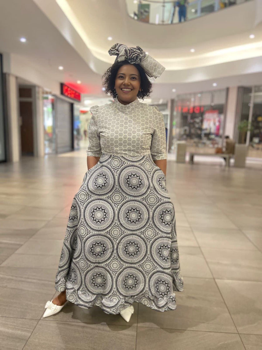 Traditional Flared Skirt Dress with Fitted Bodice and Circular Pattern Design