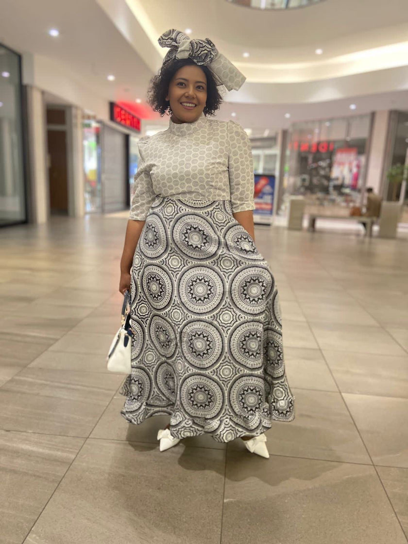 Traditional Flared Skirt Dress with Fitted Bodice and Circular Pattern Design