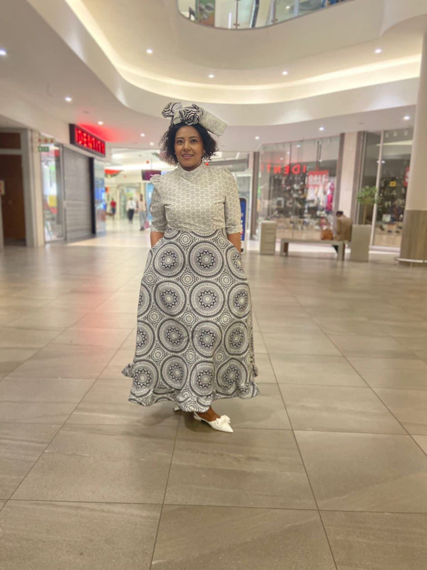 Traditional Flared Skirt Dress with Fitted Bodice and Circular Pattern Design