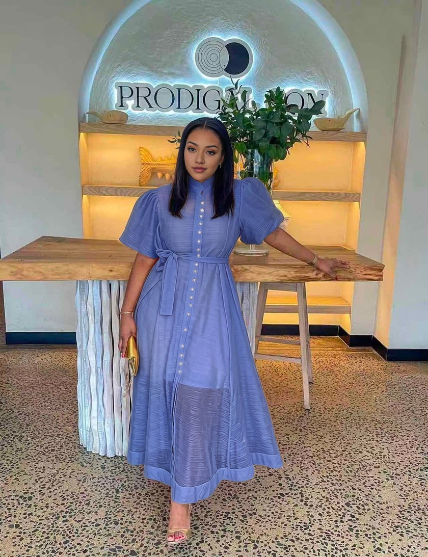 Blue midi dress with puff sleeves, front buttons, and a waist tie