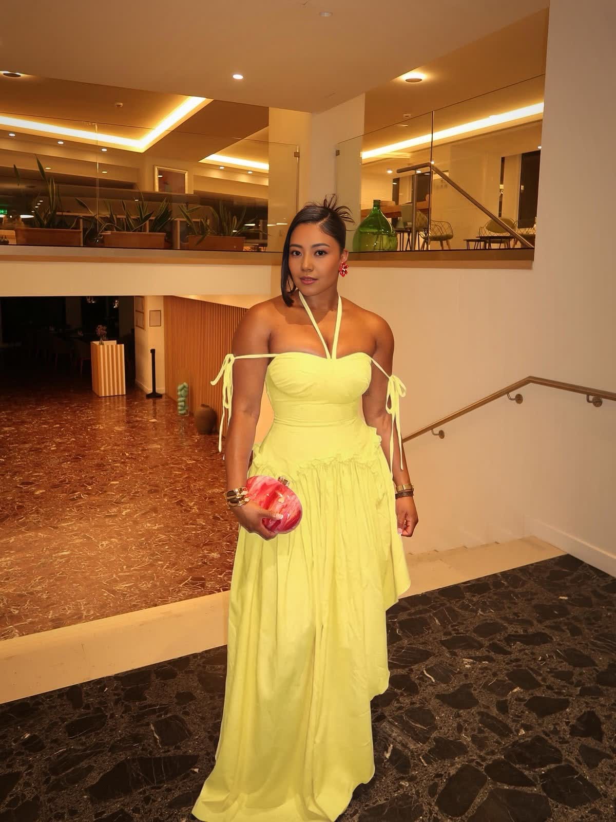 Lemon yellow halter-neck maxi dress with cold shoulders, tie straps, and a gathered waist
