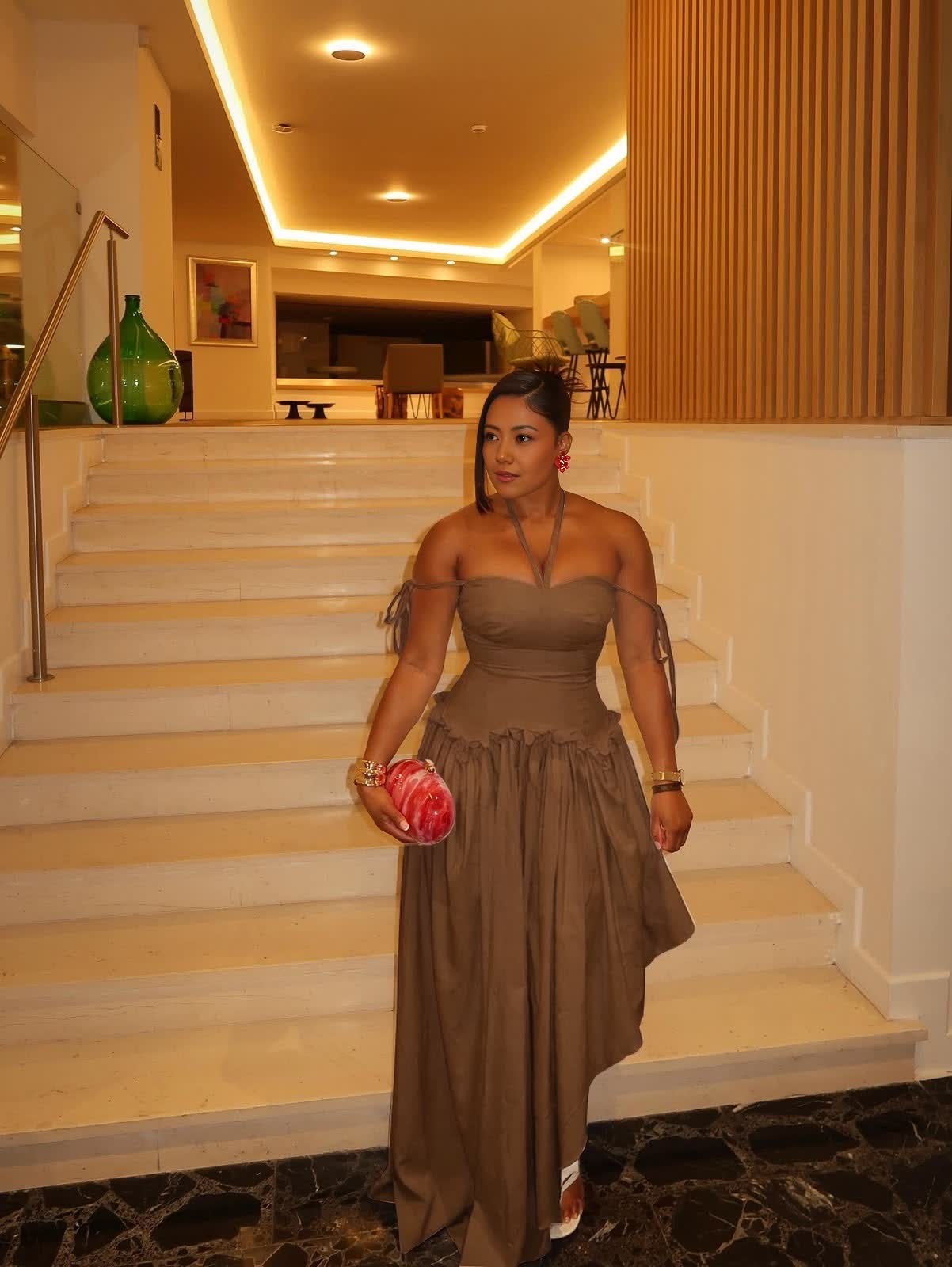 Brown halter-neck maxi dress with cold shoulders, tie straps, and a gathered waist